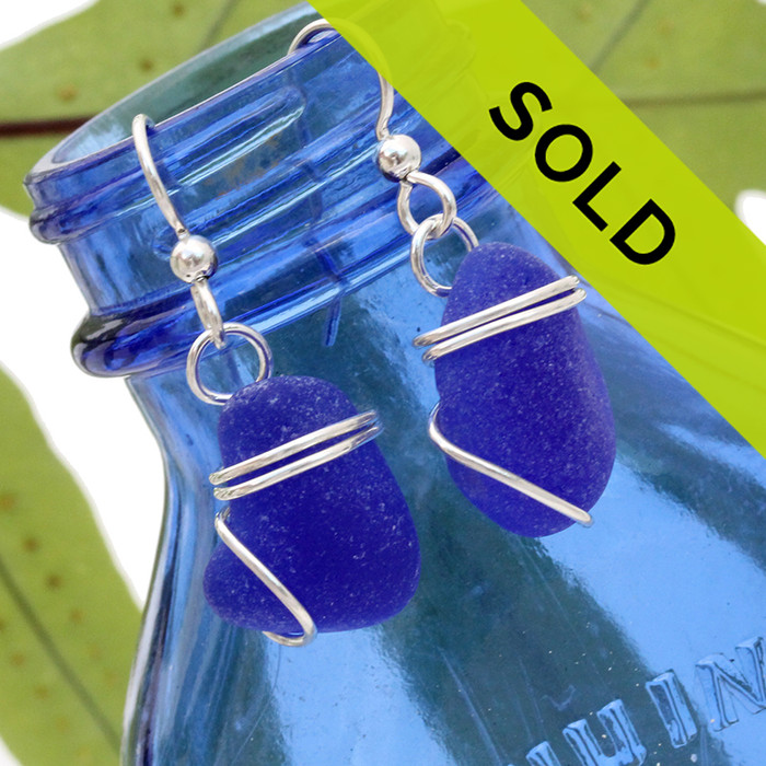 Chunky blue sea glass pieces set in a simple sterling setting!
A nice pair of genuine blue sea glass earrings.