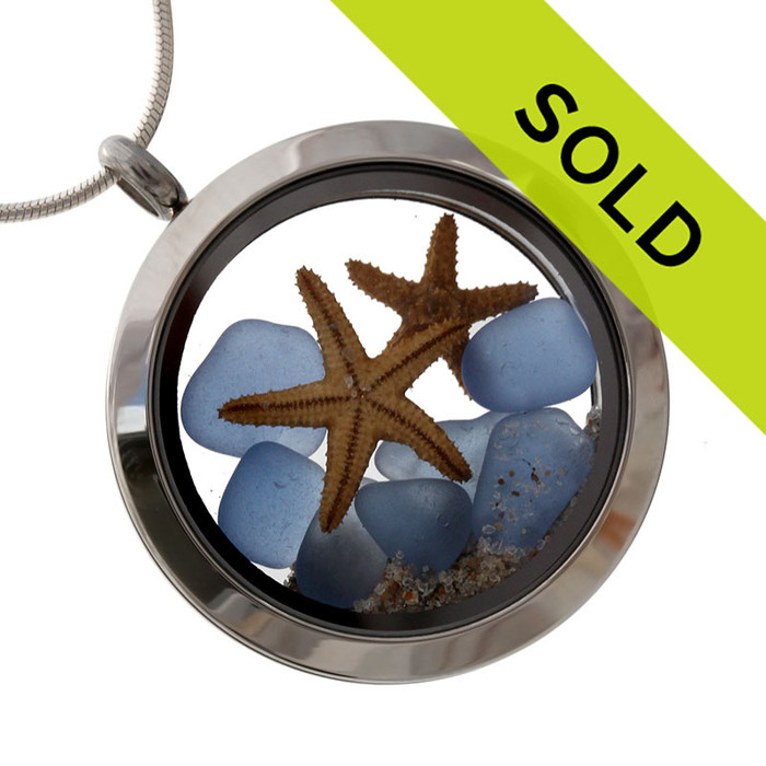 Tiny pieces of rare Carolina Blue sea glass combined with 2 starfish in a stainless steel silver locket.
Sorry this locket has been SOLD!