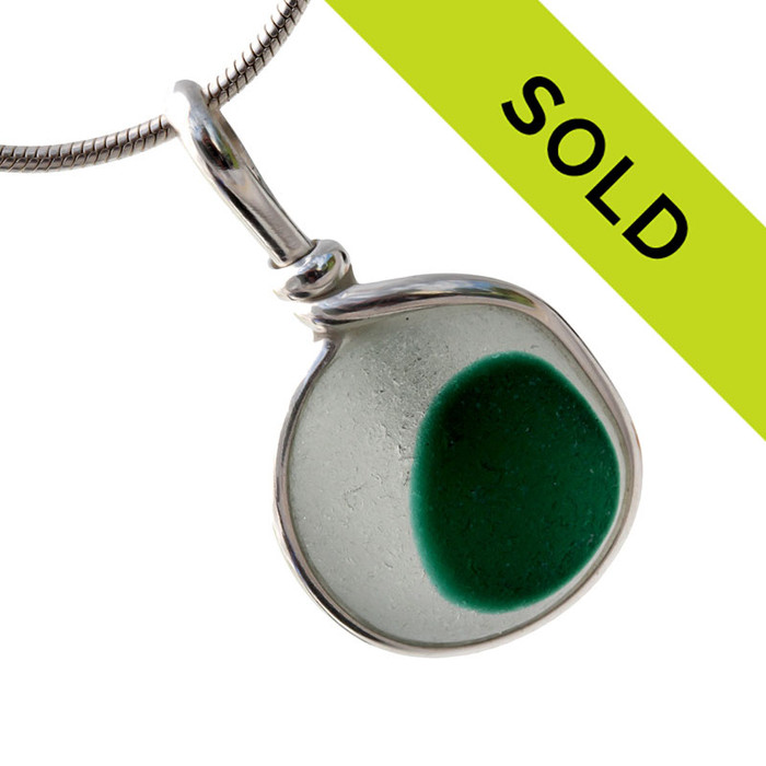 Pure white sea glass with a spot of unusual green is set in our Original Wire Bezel© pendant setting. A nice medium piece for any necklace.