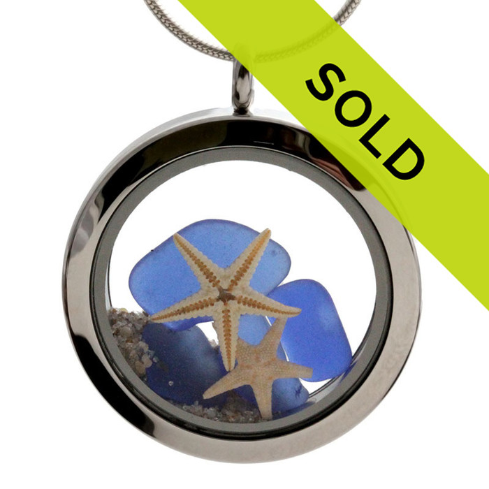 Small pieces of natural beach found blue sea glass combined with a real starfish and beach sand for your own personal beach on the go!

SORRY THIS LOCKET HAS SOLD!