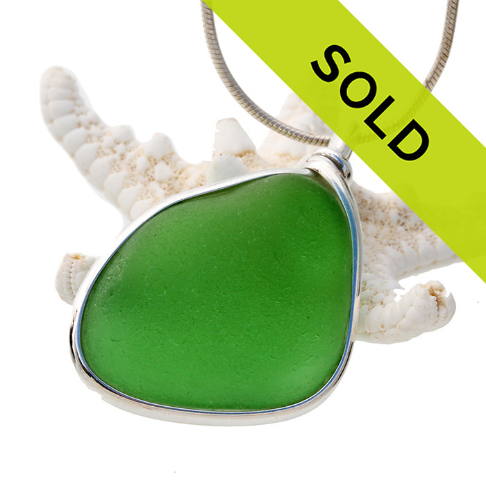 Sorry this sea glass jewelry piece has been sold!
Our Original Wire Bezel© pendant setting leaves the sea glass totally unaltered from the way it was found on the beach.