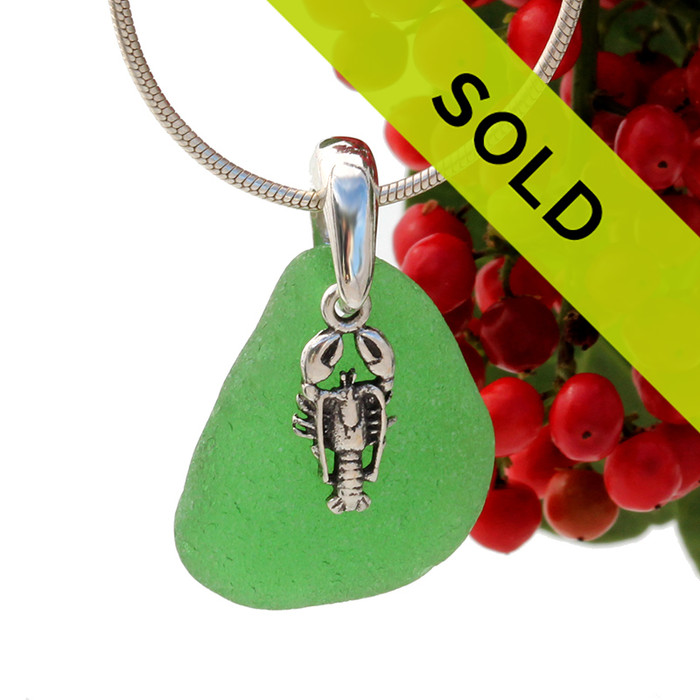 Beach found green sea glass is combined with a solid sterling lobster charm and presented on an 18 Inch solid sterling snake chain.