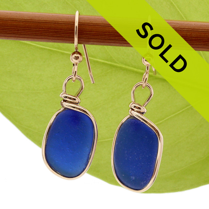 Perfect cobalt blue sea glass pieces set in our Original Wire Bezel© earring setting in 14K goldfilled earrings.

These sea glass pieces are UNALTERED from the way they were found on the beach. TOP QUALITY GENUINE SEA GLASS!