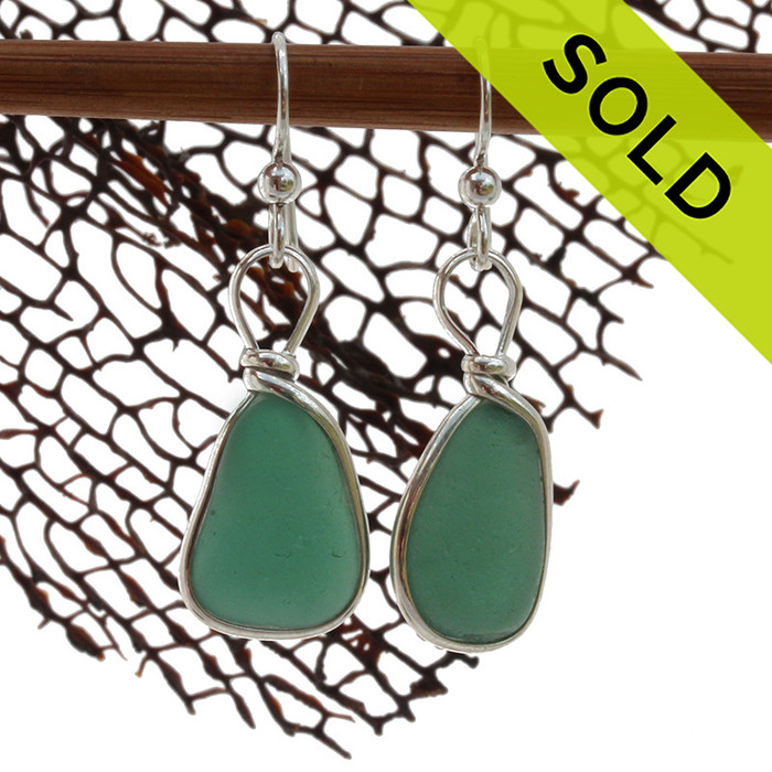 A very unusual deep aqua green sea glass pair set in our classic and elegant Original Wire Bezel setting.
Sorry this Sea Glass Earring pair has been SOLD!