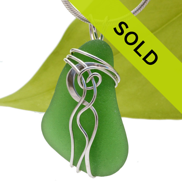 A nice natural piece of vivid green beach found sea glass in a my signature Waves© sterling necklace pendant setting.