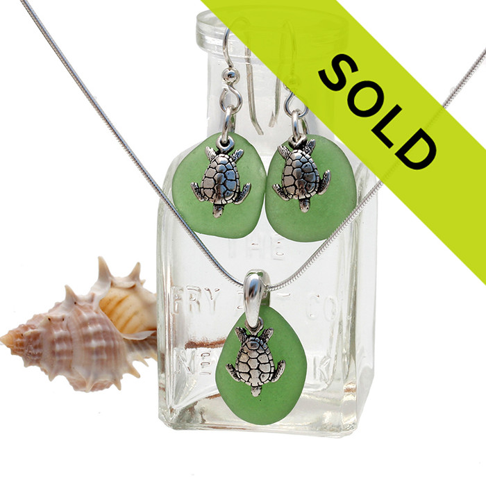 Bright green sea glass in a silver set of earring and matching pendant with silver sea turtle charms.
Sorry this set is no longer for sale...