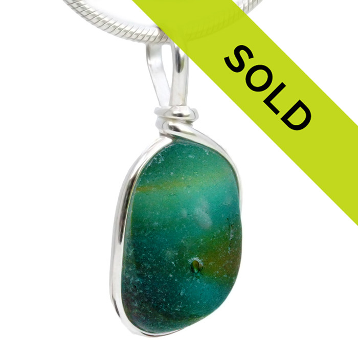 A stunning mixture of colors in this beautiful sea glass pendant.