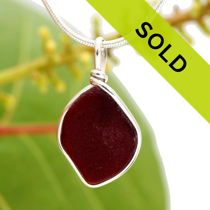 Deep ruby red sea glass from Puerto Rico is set in our Original Wire Bezel Setting in silver.
Sorry this jewelry piece has been sold!