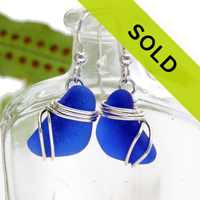 Sorry these earrings have been sold!
Blue beach found sea glass pieces set in a triple sterling silver setting!
A nice pair of genuine blue sea glass earrings.