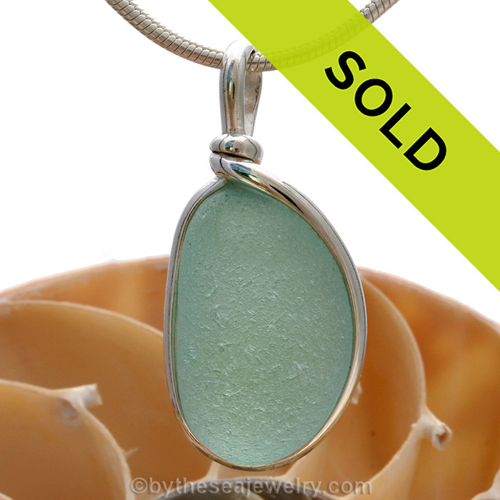 This is a great setting that leaves the sea glass piece TOTALLY UNALTERED from the way it was found on the beach in the UK!
Sorry this sea glass jewelry piece has been SOLD!/