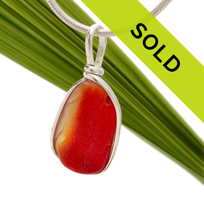 A very unusual piece that seems to be a piece of Amberina glass. . A very hard glass as much of the red sea glass from Seaham England tends to be. 
Sorry this sea glass jewelry piece has been sold!