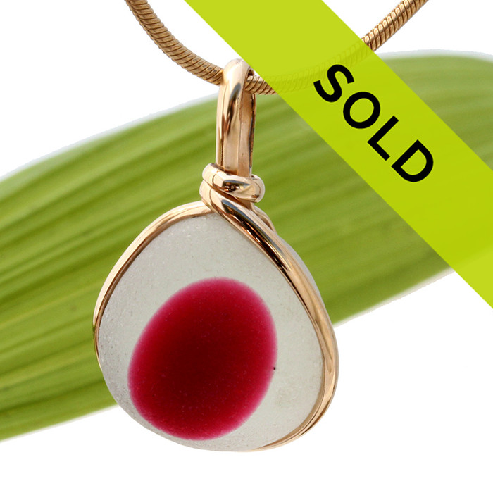 A larger piece of stunning mixed hot pink and pure white English sea glass from Seaham England set in our Original Wire Bezel© necklace pendant setting in gold.
Sorry this ultra rare sea glass jewelry piece has been sold!