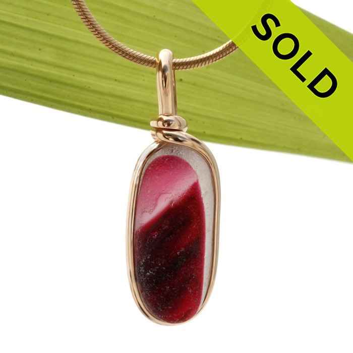 A long narrow piece of stunning mixed hot pink and pure white English sea glass from Seaham England set in our Original Wire Bezel© necklace pendant setting in gold.
SOLD - Sorry this Ultra Rare Sea Glass Pendant is NO LONGER AVAILABLE!