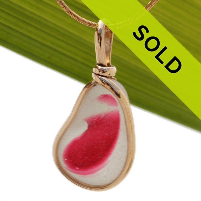 A larger and longer piece of stunning mixed hot pink and pure white English sea glass from Seaham England set in our Original Wire Bezel© necklace pendant setting in 14K Goldfilled.
Sorry this sea glass jewelry item has been sold!