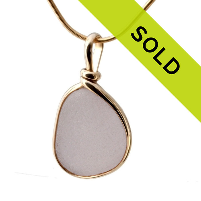 A top quality vivid purple or lavender sea glass from Maine in our Original Wire Bezel Setting© that leaves the sea glass UNALTERED from the way it was found on the beach. 
Sorry this sea glass jewelry piece has been sold!