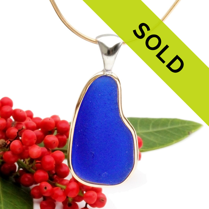 A perfect top quality piece of cobalt blue sea glass set in a mixed metal gold and sterling silver necklace.
Sorry this sea glass jewelry piece has been sold!