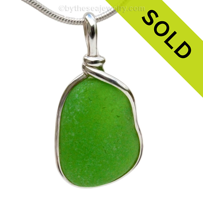 A nice larger piece of vivid bright green sea glass in an elegant and versatile and original sea glass necklace pendant setting. 
Sorry this Sea Glass Jewelry selection has already been SOLD!!