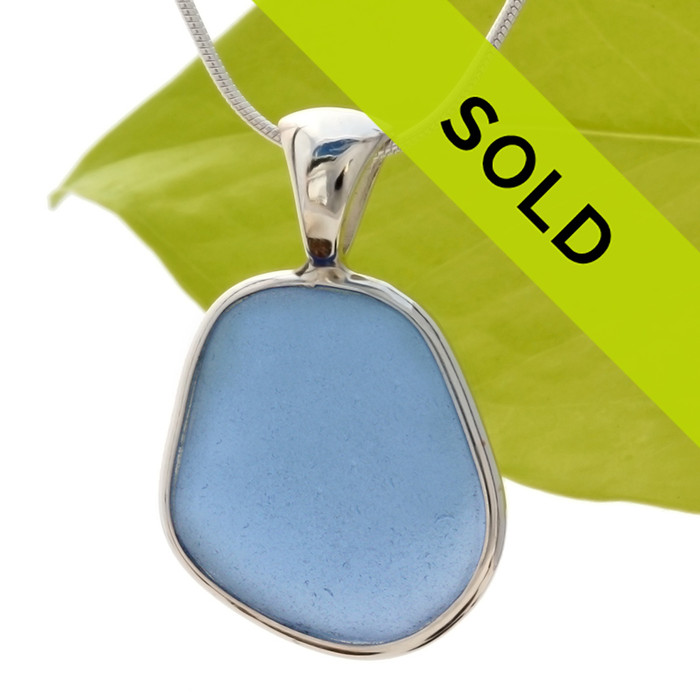 This TOP QUALITY piece of Carolina Blue sea glass is set in our Deluxe Wire Bezel© necklace pendant setting. This setting leaves the sea glass TOTALLY UNALTERED from the way it was found on the beach. One of our last larger pieces in this color.
Sorry this sea glass jewelry piece has been sold!