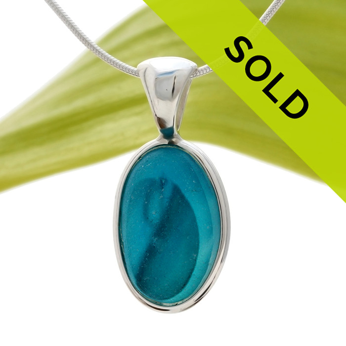 A  natural beach found mixed vivid aqua sea glass set in our Deluxe Wire Bezel©
Sorry this sea glass jewelry piece has been sold!