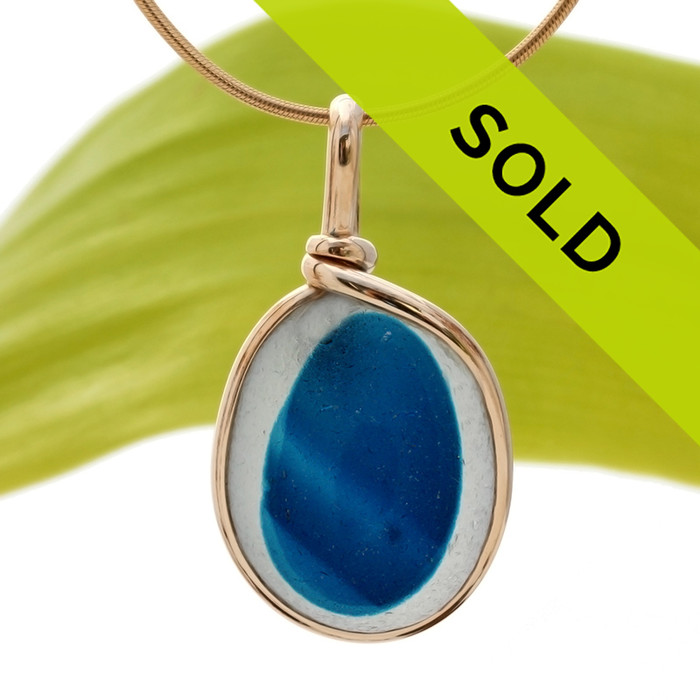 This is a stunning piece of longer mixed teal blue EndODay sea glass set in our Original Wire Bezel© pendant setting in gold. Classic and timeless.
Sorry this sea glass jewelry piece has been sold!