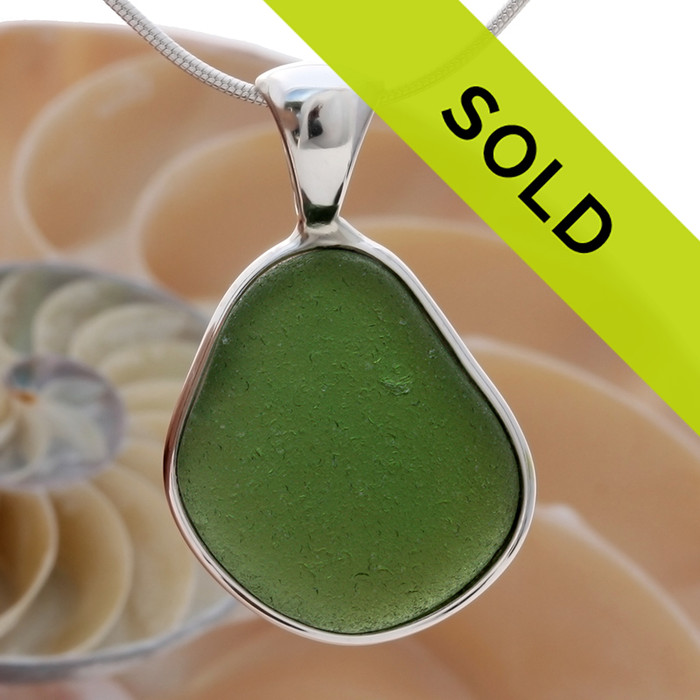 A LARGE natural jungle green sea glass set in our Deluxe Wire Bezel©
A great necklace for any time of year and perfect for any sea glass lover!
Sorry this sea glass jewelry piece has been sold!