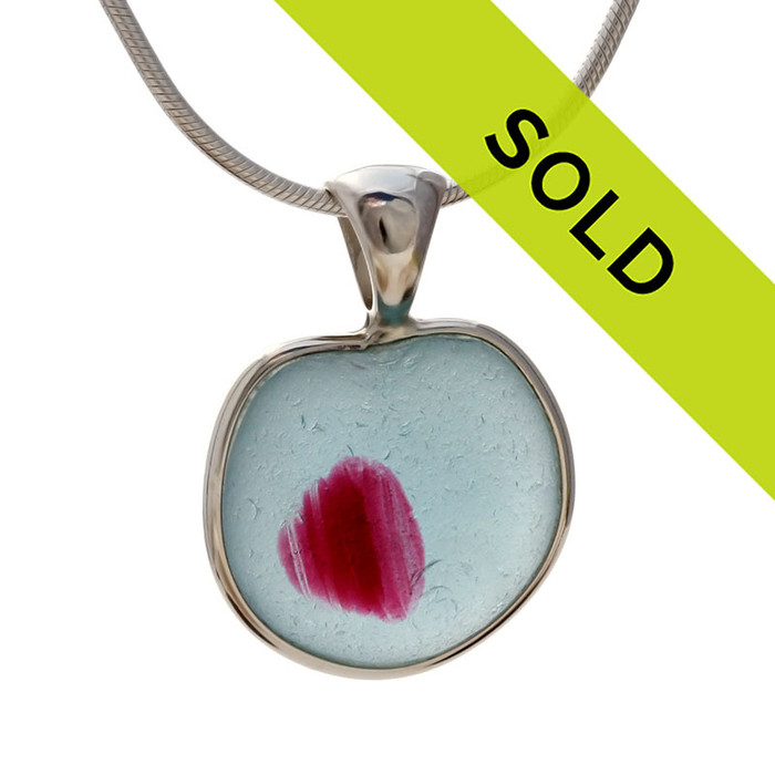 A  natural beach found mixed blue and vivid pink  sea glass heart set in our Deluxe Wire Bezel©
Sorry this sea glass necklace pendant has been sold!