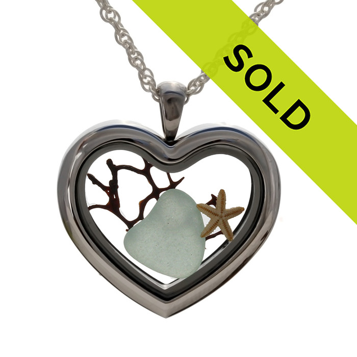 A Seafoam Green sea glass heart, bit of seafan and a small starfish combined a heart locket in this sea glass locket necklace.
Sorry this sea glass jewelry selection has been sold!