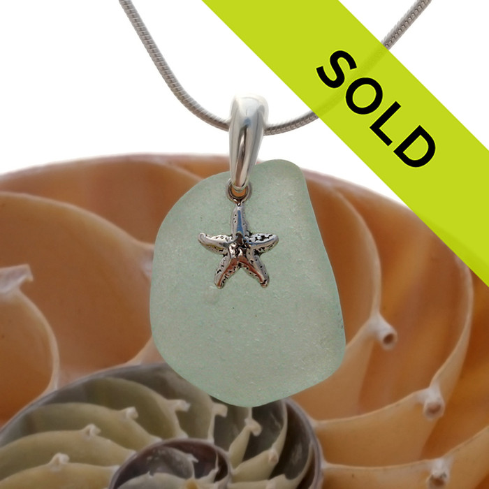 Vivid sea green sea glass is combined with a solid sterling bail and starfish sterling charm in this lovely sea glass necklace pendant. Sorry this sea glass necklace has been sold!