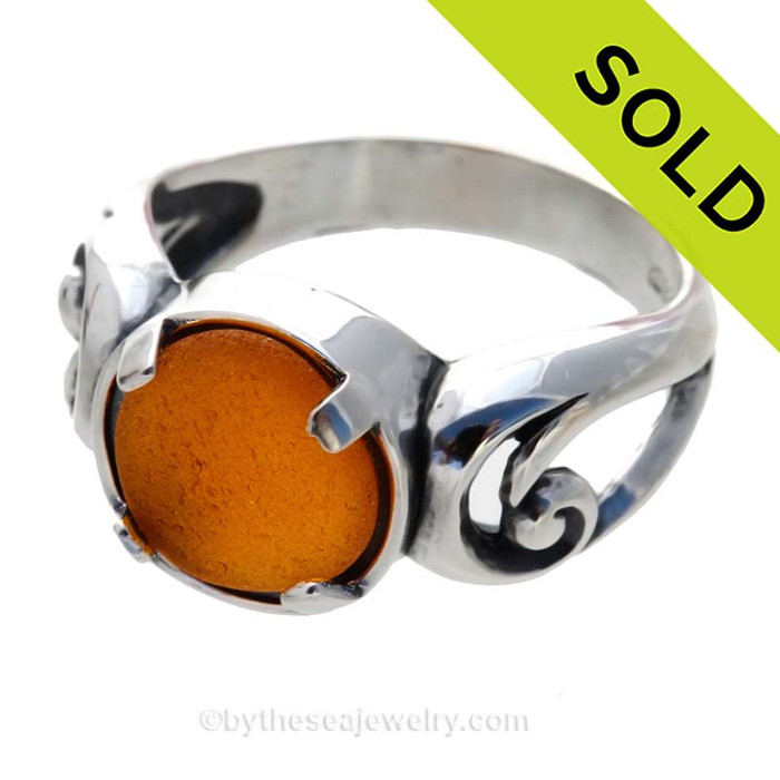 NATURAL Glowing Honey Amber sea glass ring in a solid sterling silver swirl setting.
Sorry this Sea Glass Ring has been SOLD!