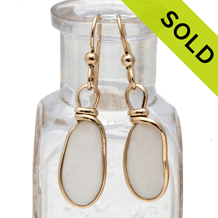 Smaller long natural UNALTERED white Sea Glass Earrings set in our Original Wire Bezel© setting in 14K G/F.
This is a bright and smaller perfectly matched glass in a natural state, just the way it was found on the beach. 