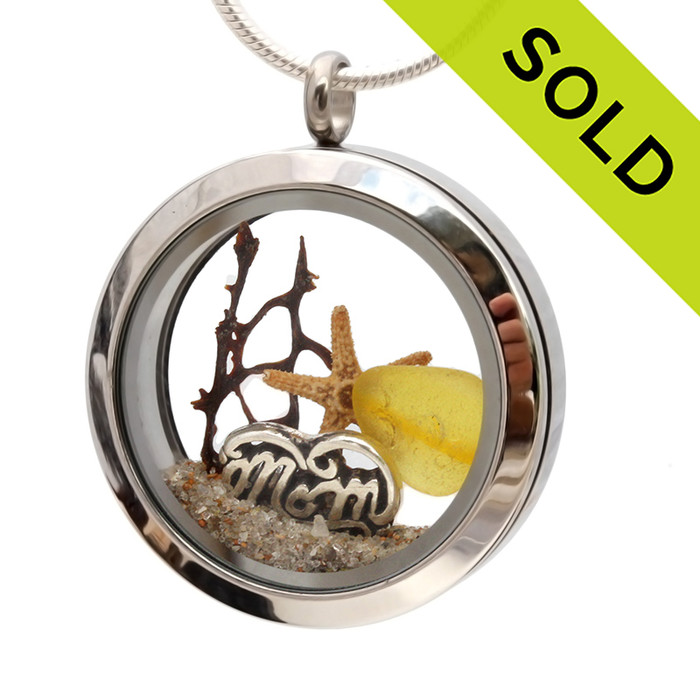 An Ultra Rare piece of genuine golden sea glass  a real starfish, a bit of seafan and a solid sterling MOM charm completes this sea glass locket necklace.
SOLD - Sorry This Sea Glass Jewelry Selection Is NO LONGER AVAILABLE!
