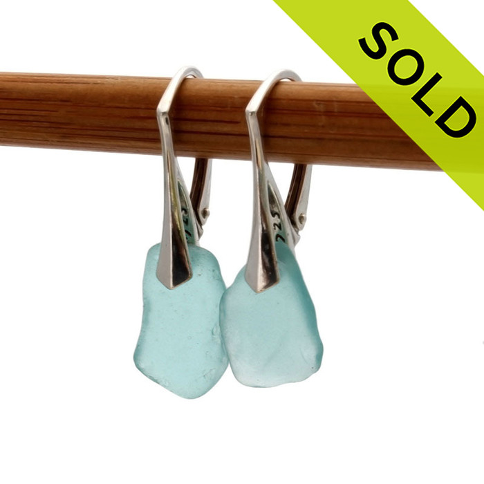 Simple beach found aqua sea glass pieces set on top quality solid sterling silver leverbacks.
SOLD - Sorry these Sea Glass Earrings are no longer available.