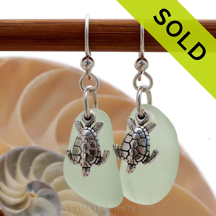 A perfect matched pair of beautiful vivid green sea glass earrings combined with solid sterling Sea Turtle charms and a setting that leaves much of the beauty of these sea glass pieces shine.
Sorry this Sea Glass jewelry selection has been SOLD!