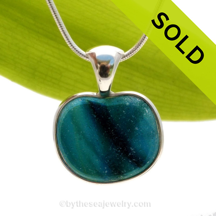 This ultra ULTRA RARE rare Seaham sea glass heart multi bright blue and teal pendant is set in our Deluxe Wire Bezel© pendant setting.
Sorry this sea glass jewelry selection has been sold!