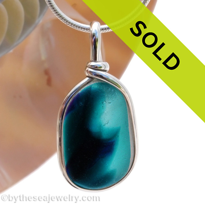 A beautiful larger piece of deep aqua green English Multi sea glass set for a necklace in our Original Sea Glass Bezel© in solid sterling silver setting.
Sorry this sea glass necklace pendant has been sold!