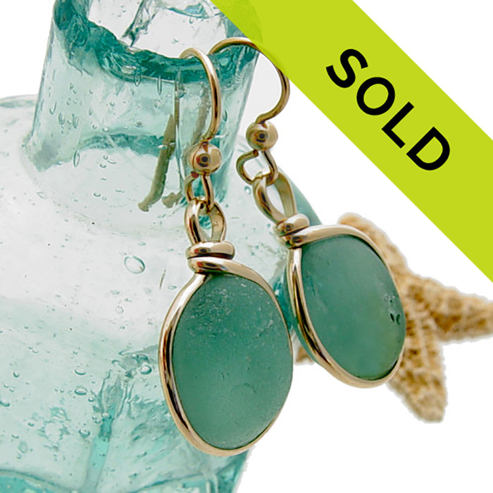 Sorry these aqua blue sea glass earrings in gold have been SOLD!