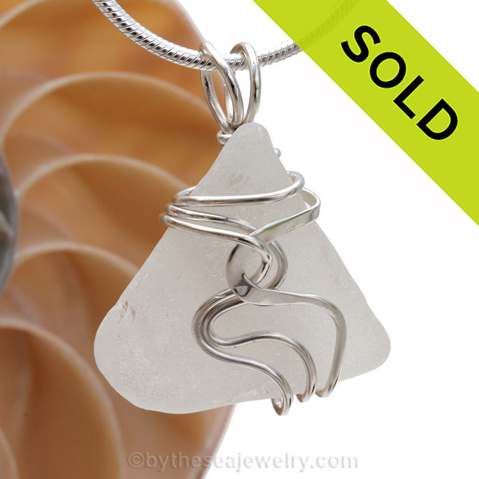 Good quality pure white sea glass set in our Original Wire Bezel pendant setting. This setting leaves the sea glass totally UNALTERED from the way it was found on the beach!
Sorry this piece of sea glass jewelry has been sold!