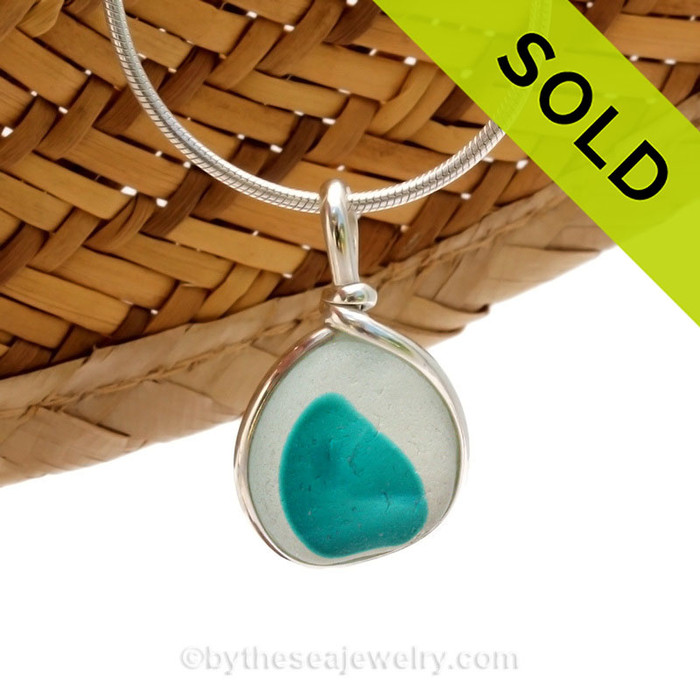 An vivid Electric Aqua spotted English Multi sea glass set for a necklace in our Original Sea Glass Bezel© in solid sterling silver setting.
Sorry this piece of sea glass jewelry has been sold!