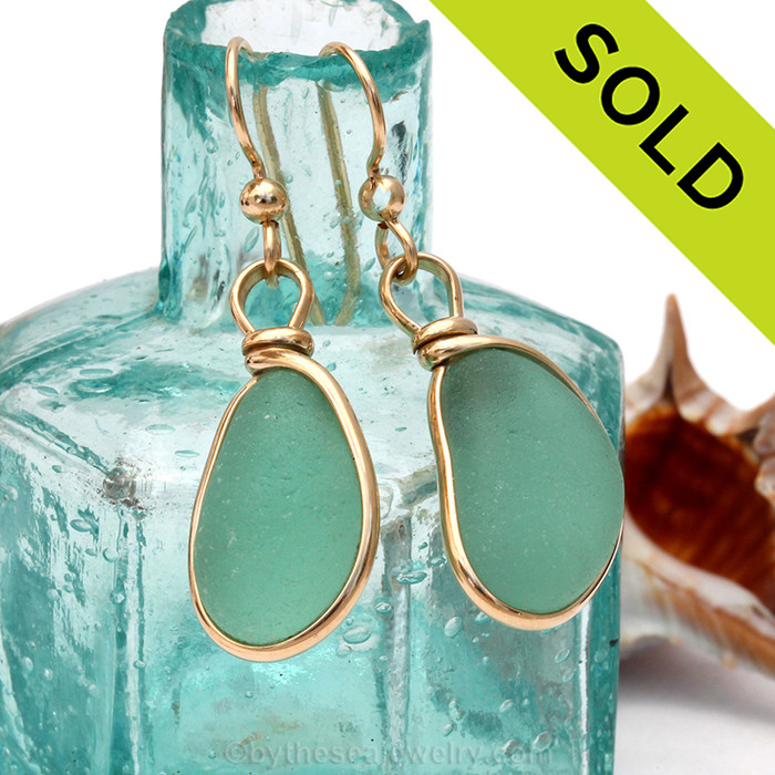 Stunning bright aqua green sea glass from Seaham England set in our Original Wire Bezel© 14K Rolled Gold earring.
Sorry these Sea Glass Earrings have been SOLD!