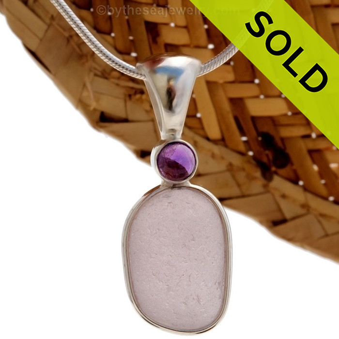 This beautiful Bright Perfect Purple sea glass piece is set in our Deluxe Wire Bezel© pendant setting with a genuine Amethyst Domed gem.
Sorry this one of a kind Sea Glass Jewelry Piece has been SOLD!