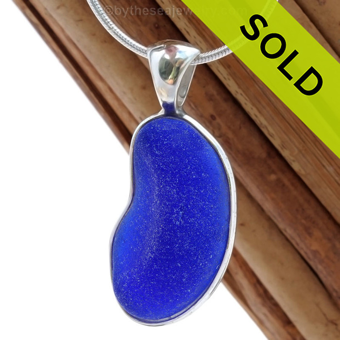 A nice piece of cobalt blue sea glass set in a sterling silver necklace Deluxe Wire Bezel© setting.
Sorry this Sea Glass Jewelry selection has been SOLD!