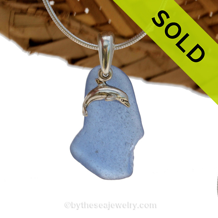 A nice piece of Carolina Blue Certified Genuine Sea Glass in a Sterling Necklace with a Dolphin Charm
Sorry this Sea Glass Jewelry piece has been SOLD!