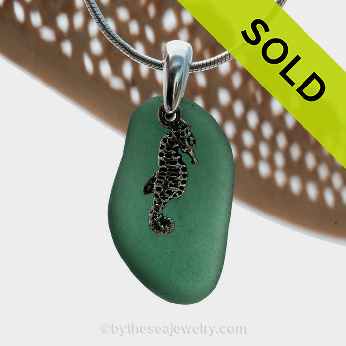A perfect piece of deep aqua green sea glass is combined with a solid sterling sea horse and presented on an 18 Inch solid sterling snake necklace chain.
Sorry this Sea Glass Necklace has been SOLD!