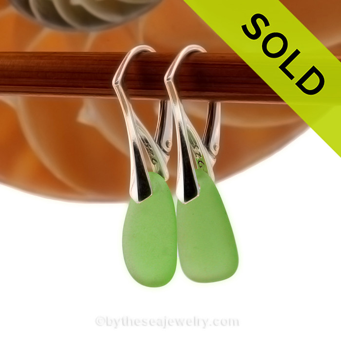 Green bright genuine sea glass pieces shaped only by the sea, sand and time are suspended on solid sterling leverback earrings.
SOLD - Sorry these Sea Glass Earrings are NO LONGER AVAILABLE!