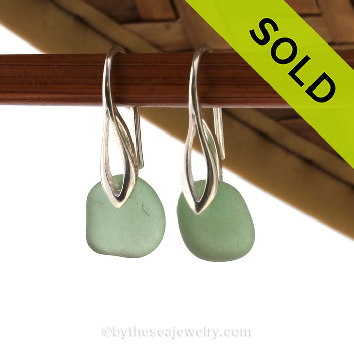Simple beach found petite green sea glass earrings on solid sterling silver deco hooks.
Sorry these Sea Glass Earrings have been sold!