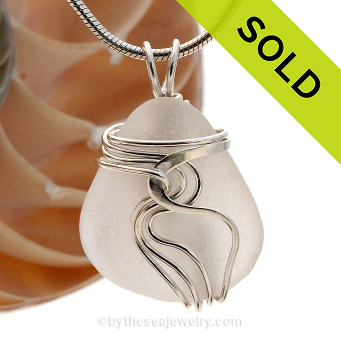 A nice piece of pure white natural sea glass in our WAVES sterling pendant setting that maximizes the bling of silver yet leaves most of the sea glass open and UNALTERED from the way it was collected on the beach.
Sorry this sea glass jewelry piece has been SOLD!