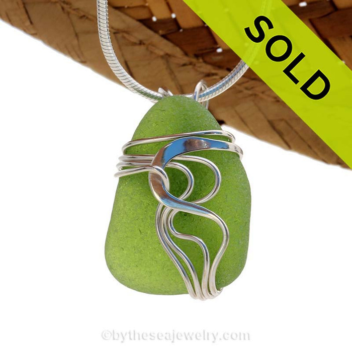 A beautiful natural medium bright green Sea Glass Pendant set in our original signature "Waves" setting in solid sterling silver.
SOLD - Sorry this Sea Glass Jewelry selection is NO LONGER AVAILABLE