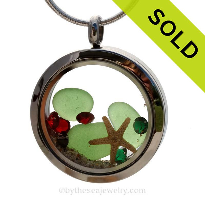 Green Genuine beach found sea glass and a real starfish and beach make this a great locket necklace for the holidays. Ruby and Deep Green crystal gems finish the locket with some extra bling.
Sorry this piece of Sea Glass Jewelry has been SOLD!