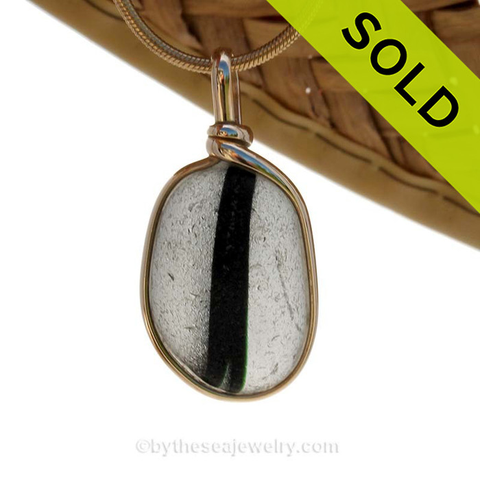 SOLD - Sorry This ULTRA RARE Sea Glass Jewelry Pendant  Is NO LONGER AVAILABLE!
An Ultra Rare piece of mixed black and white sea glass set in our Original Wire Bezel© setting in 14K Goldfilled.