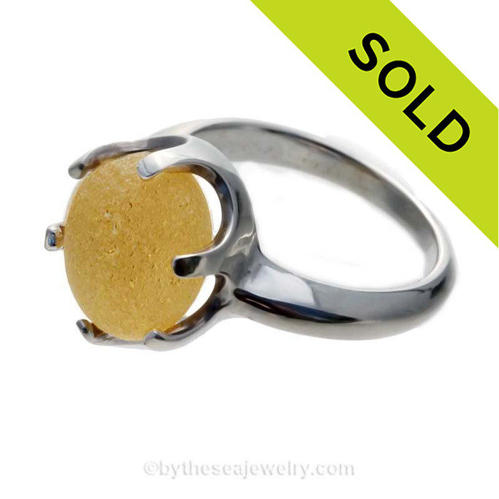 A stunning and perfect buttery yellow English sea glass piece set in a solid sterling silver ring.
